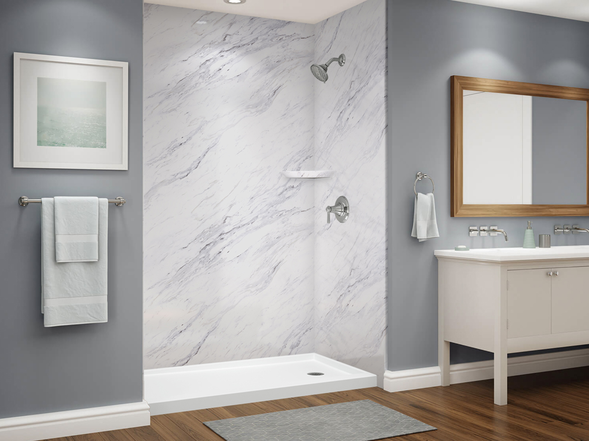 Smooth Calcutta Bella Stone shower with matching shelf